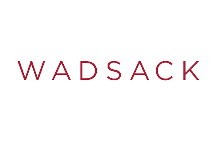 The logo for Wadsack on white background.
