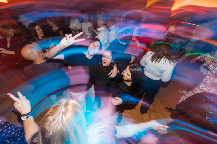 A group of people are dancing at a party.