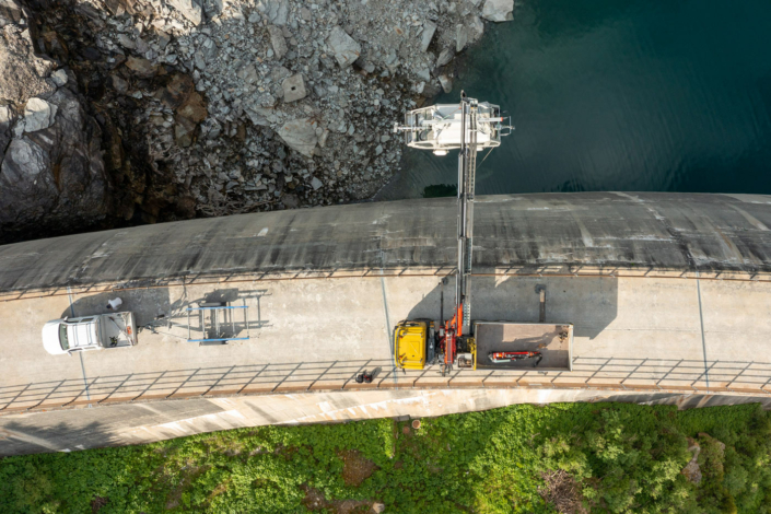 An aerial view of a construction crew working on a dam.