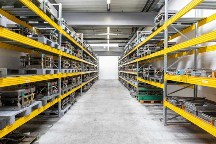 A large warehouse with many shelves and racks.