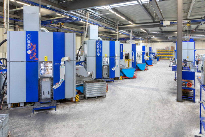 Blue and white machines in a factory.